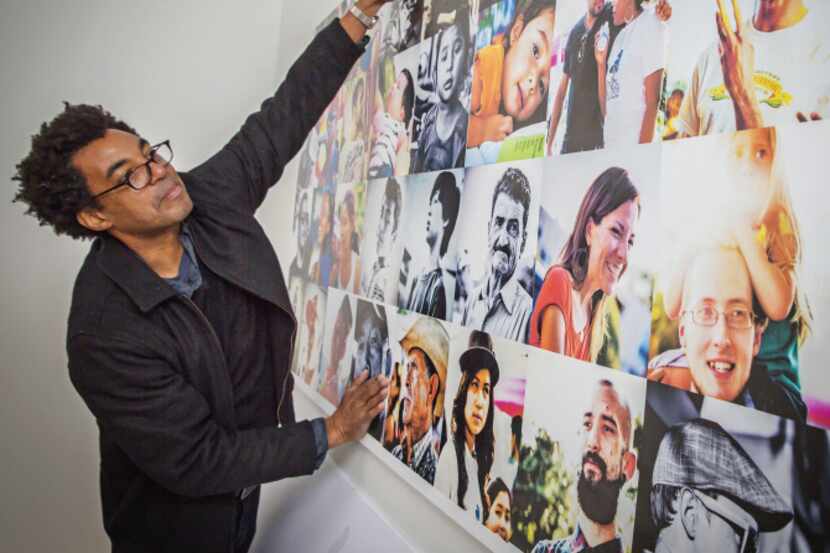 Artist Rick Lowe checked the installation of a photo collage at a Trans.Lation Vickery...