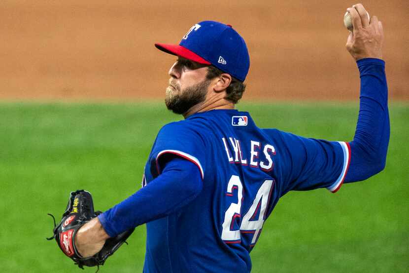 Texas Rangers Jordan Lyles (24) pitches during an intrasquad game at Summer Camp inside...