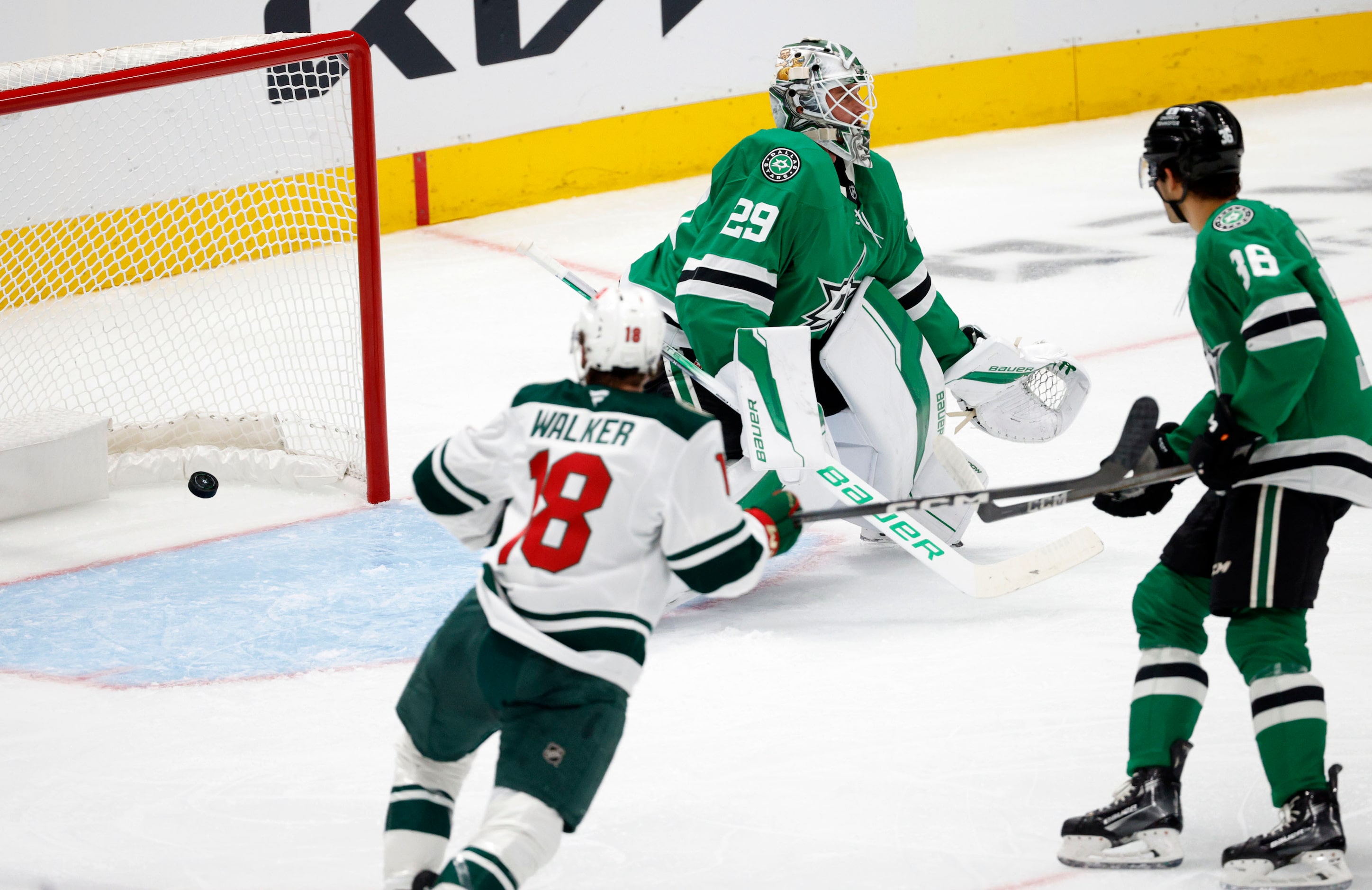 Dallas Stars goaltender Jake Oettinger (29) cannot stop a shot by Minnesota Wild forward...