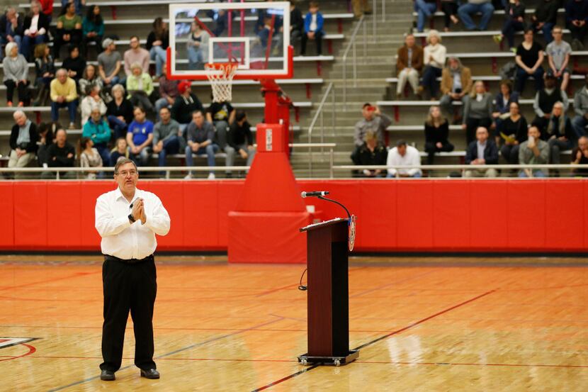 Congressman Michael Burgess answers a question during a town hall meeting at Marcus High...