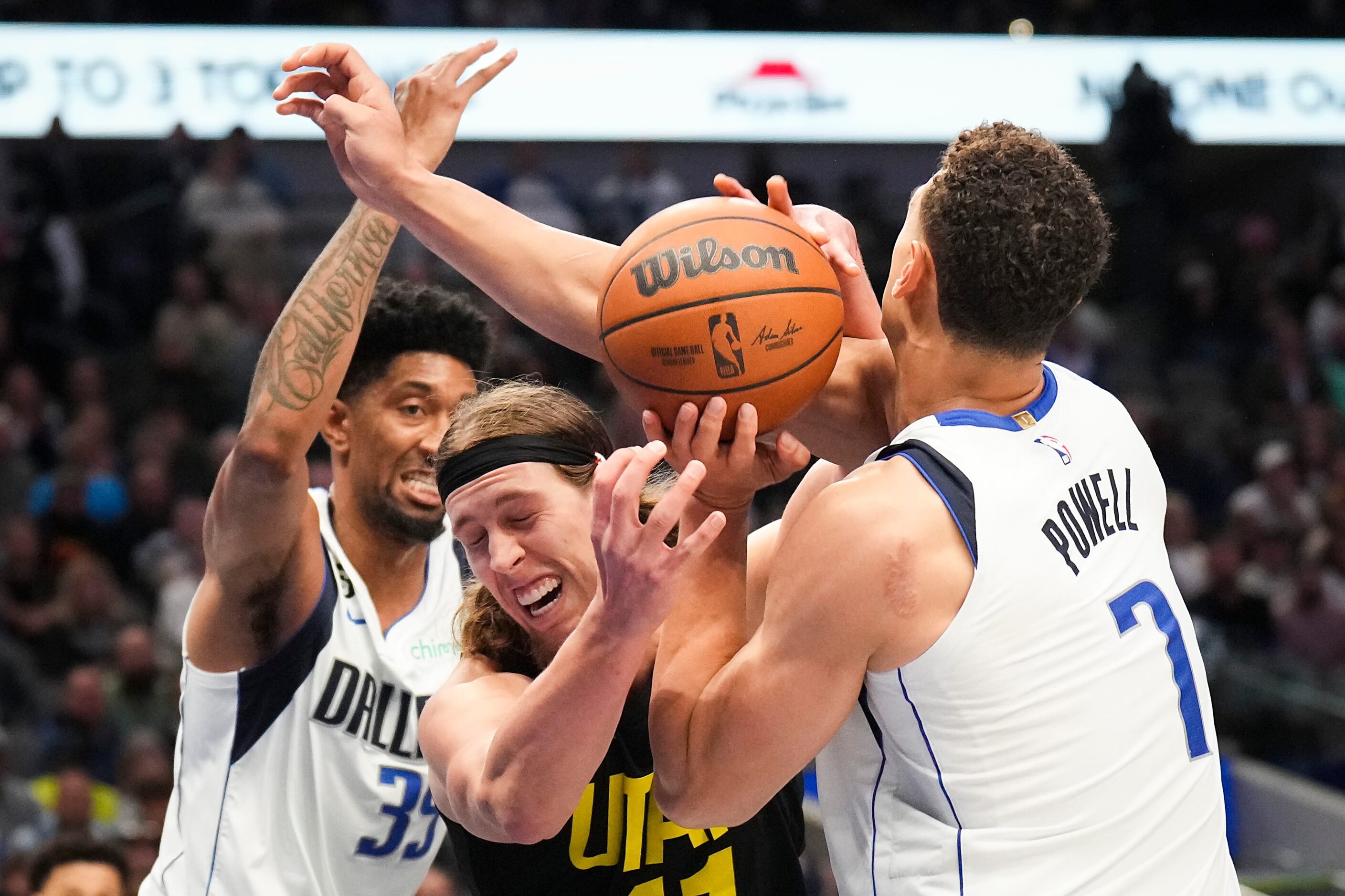 Utah Jazz forward Kelly Olynyk (41) loses the ball as he tries to drive between Dallas...