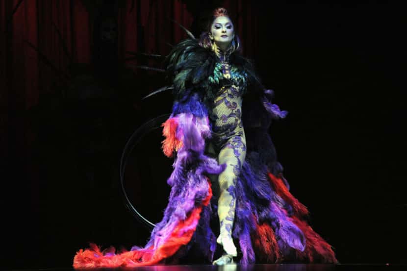 Hoop manipulation artist Irina Akimova makes a dramatic entrance on the opening night of...