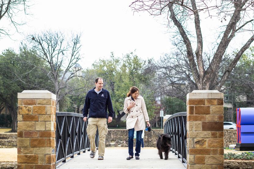 Ken and Alyssa Bohacs of Dallas walk with their dog Max at Williams Park in Dallas. The LOVE...