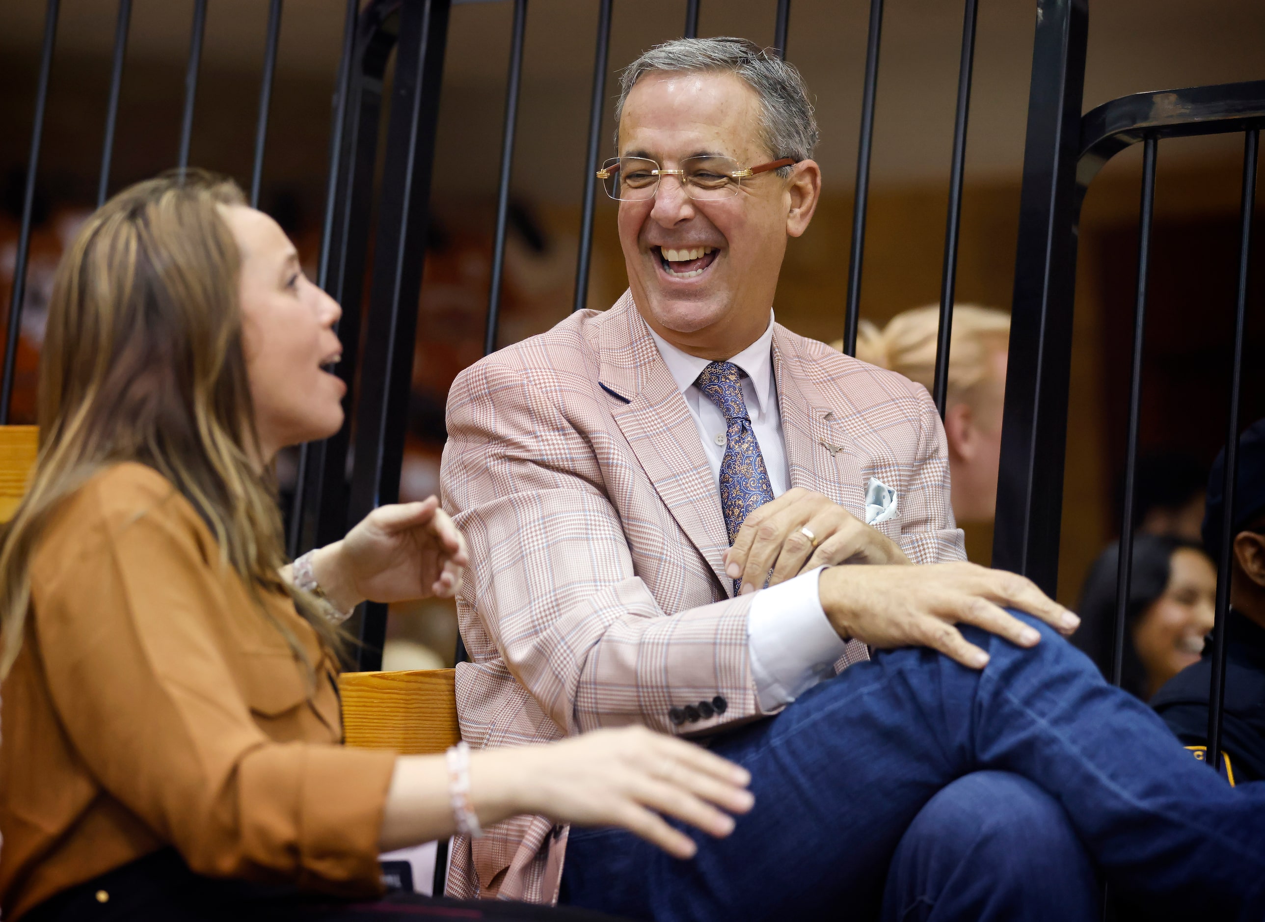 University of Texas Athletic Director Chris Del Conte (right) laughs along with Sports...