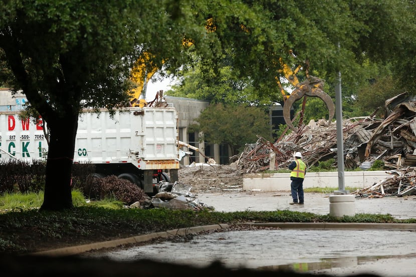 Work crews demolish the former headquarters of the Dallas Cowboys at Valley Ranch in Irving.