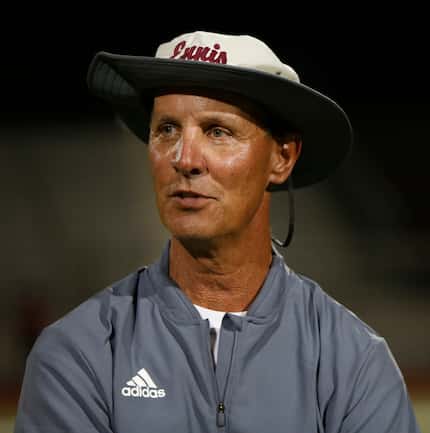 Ennis head football coach Sam Harrell is photographed following his team's scrimmage against...