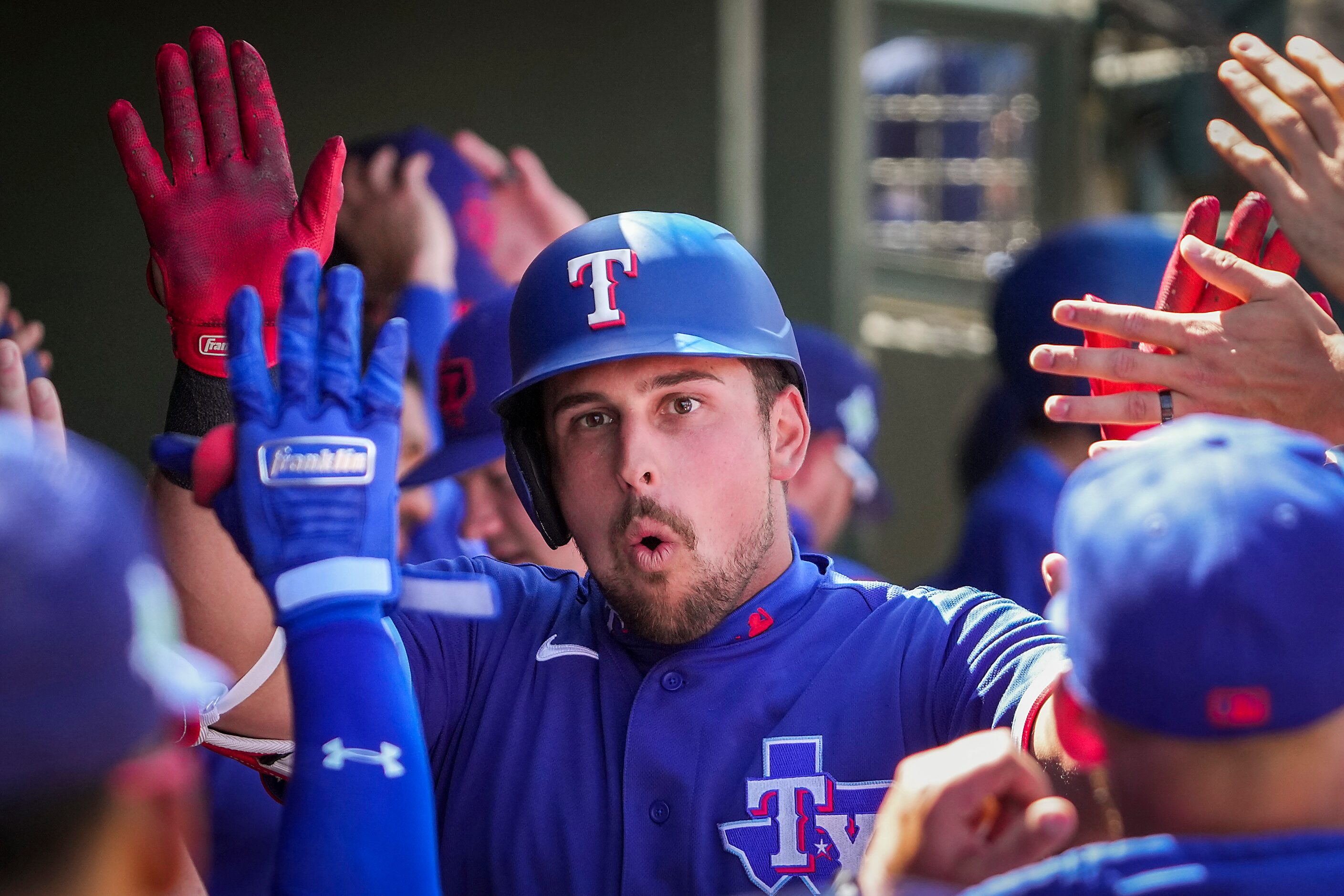 Texas Rangers first baseman Nathaniel Lowe celebrates after hitting a home run during the...