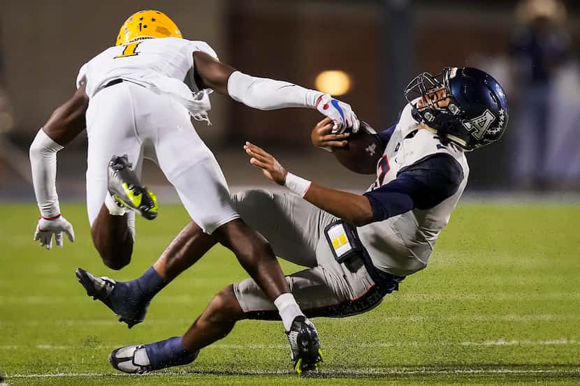 Allen quarterback Mike Hawkins (3) is dropped for a loss by McKinney defensive back Xavier...