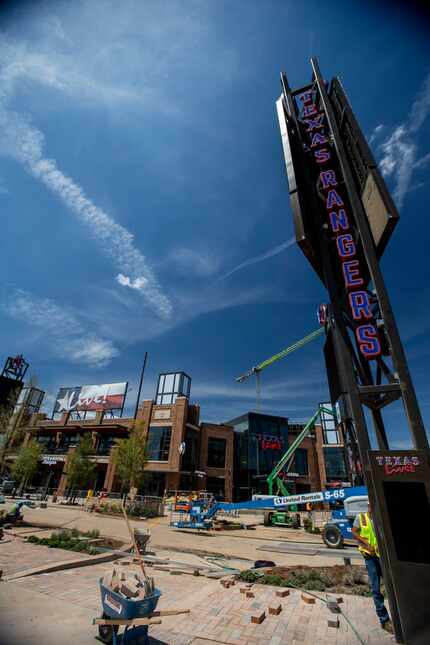 Construction crews finish the exterior of the Texas Live! entertainment venue, with Texas...
