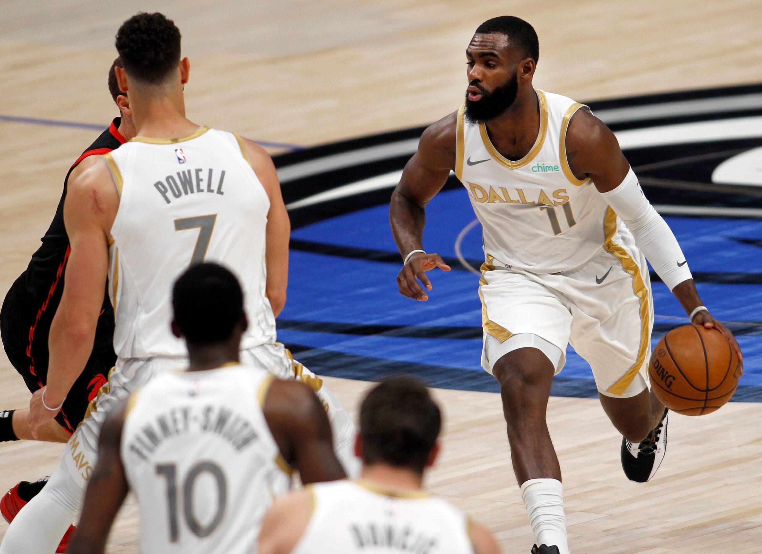 Mavericks forward Tim Hardaway Jr. (11) brings the ball past mid court during second half...