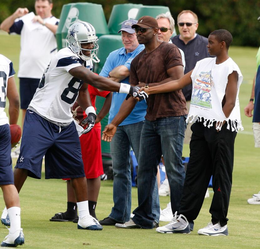 Dez Bryant shakes hands with Michaal Irvin's son Michael at Cowboys Mini Camp at Valley...