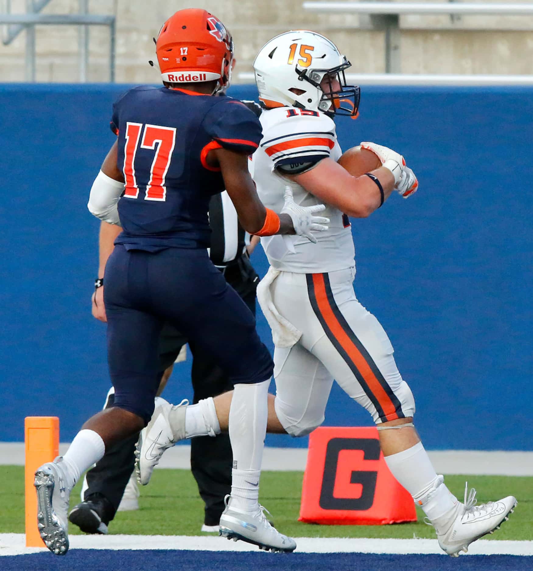 Wakeland High School tight end Chance Delashaw (15) crosses the goal line in front of...