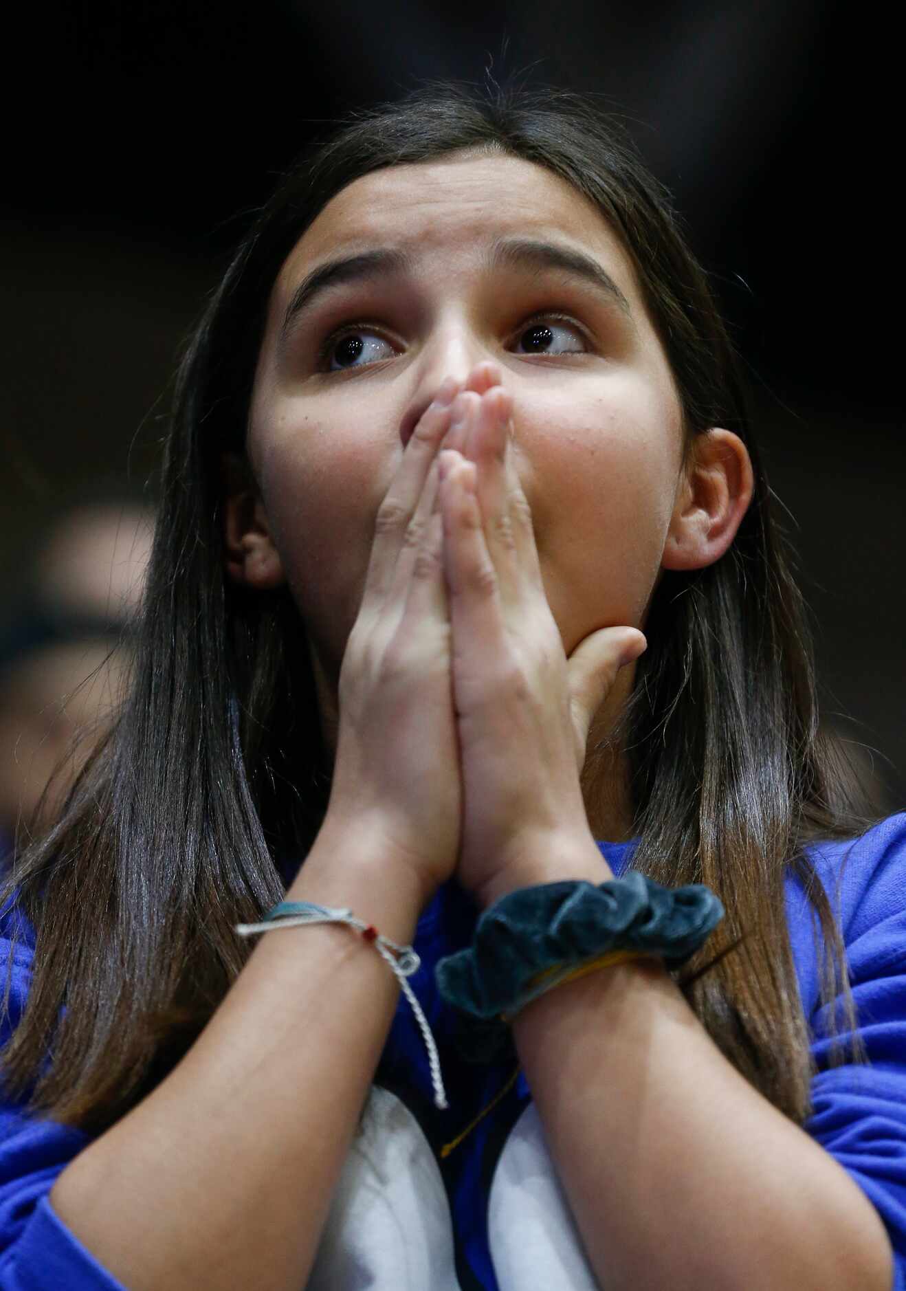Mackenzie Barnies, 11, of Midlothian, anxiously watches the final moments of Midlothian's...