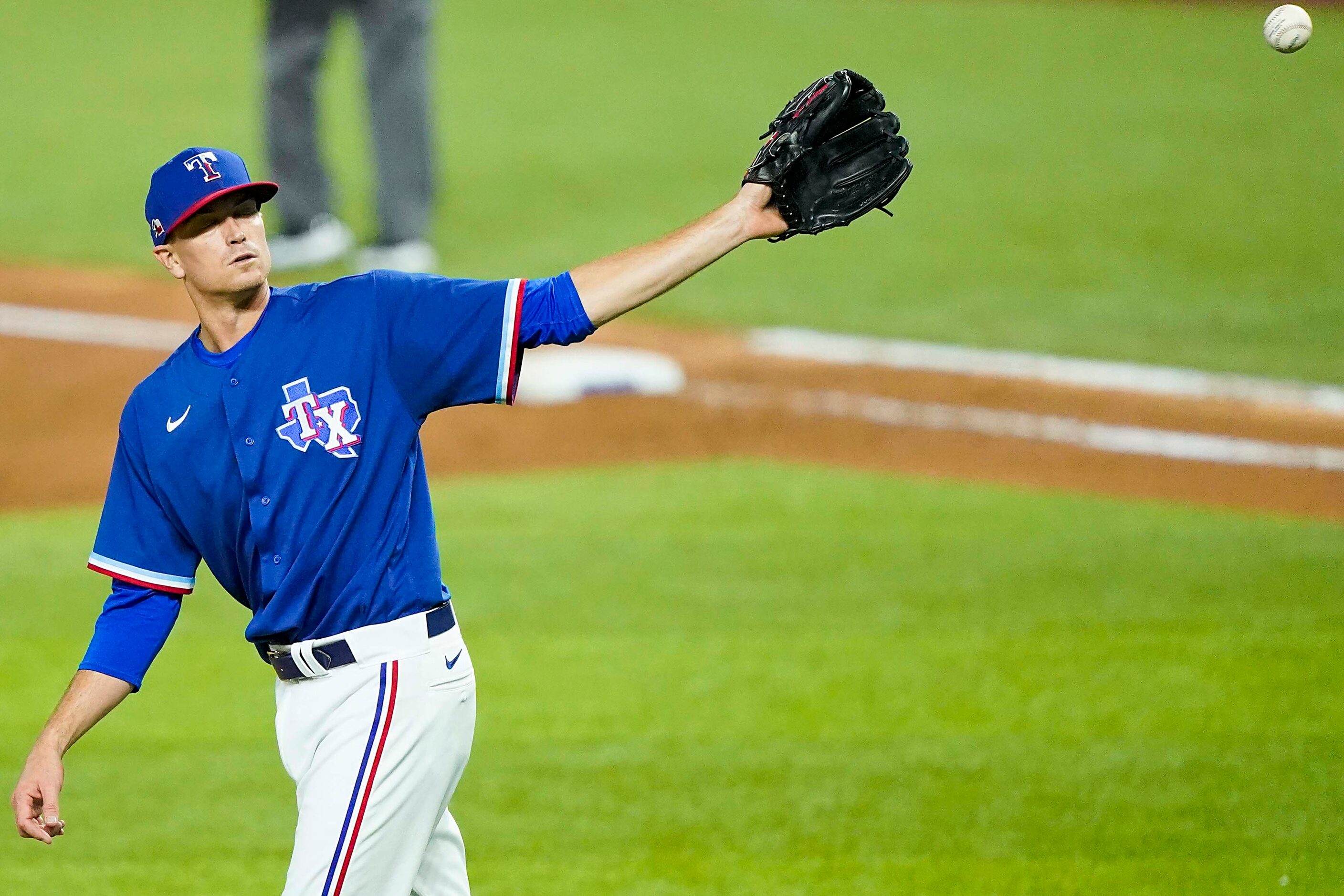 Texas Rangers pitcher Kyle Gibson gets a new ball after giving up a 2-run home run to...