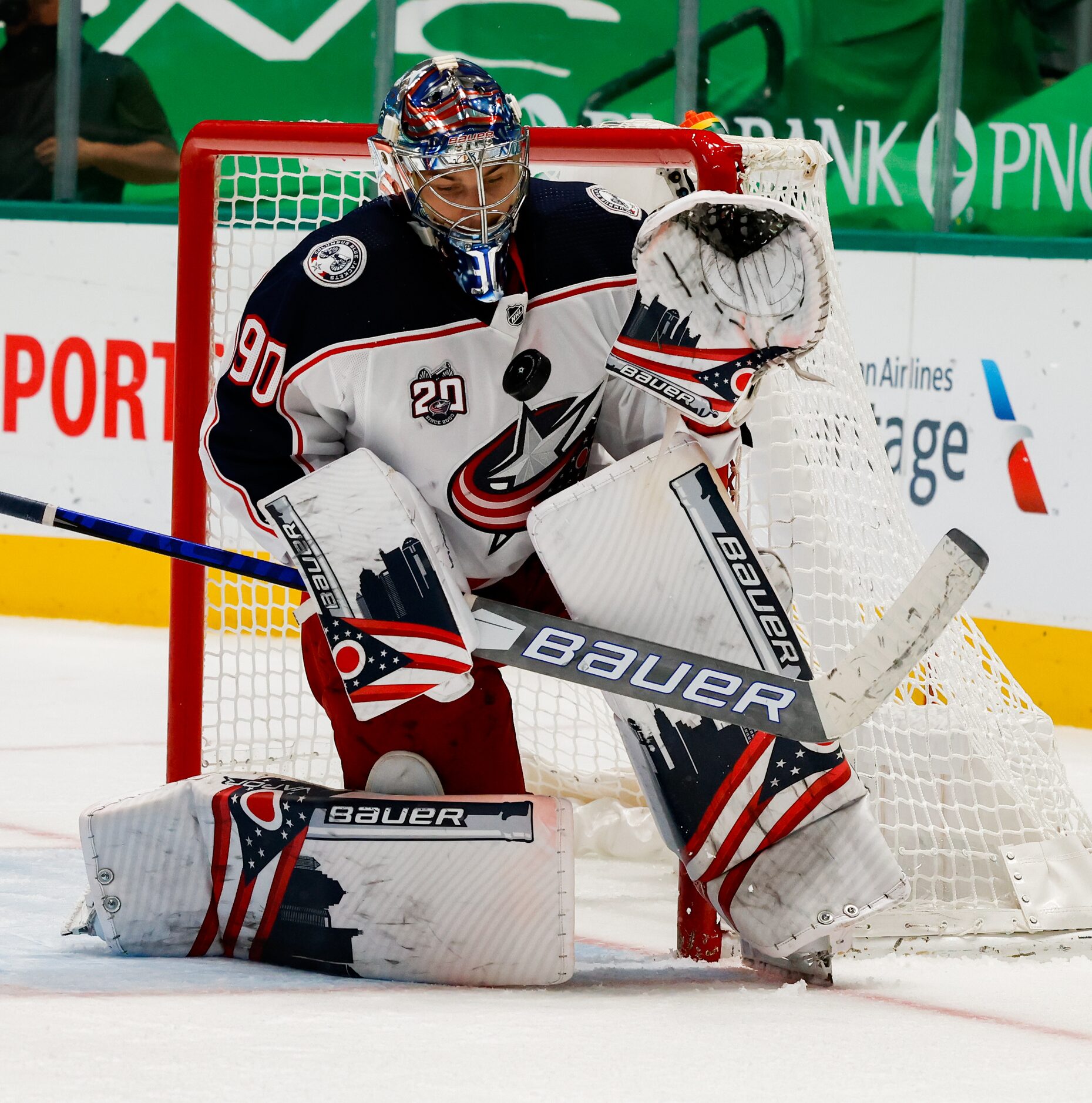 Columbus Blue Jackets goaltender Elvis Merzlikins (90) blocks a Dallas Stars goal in the...