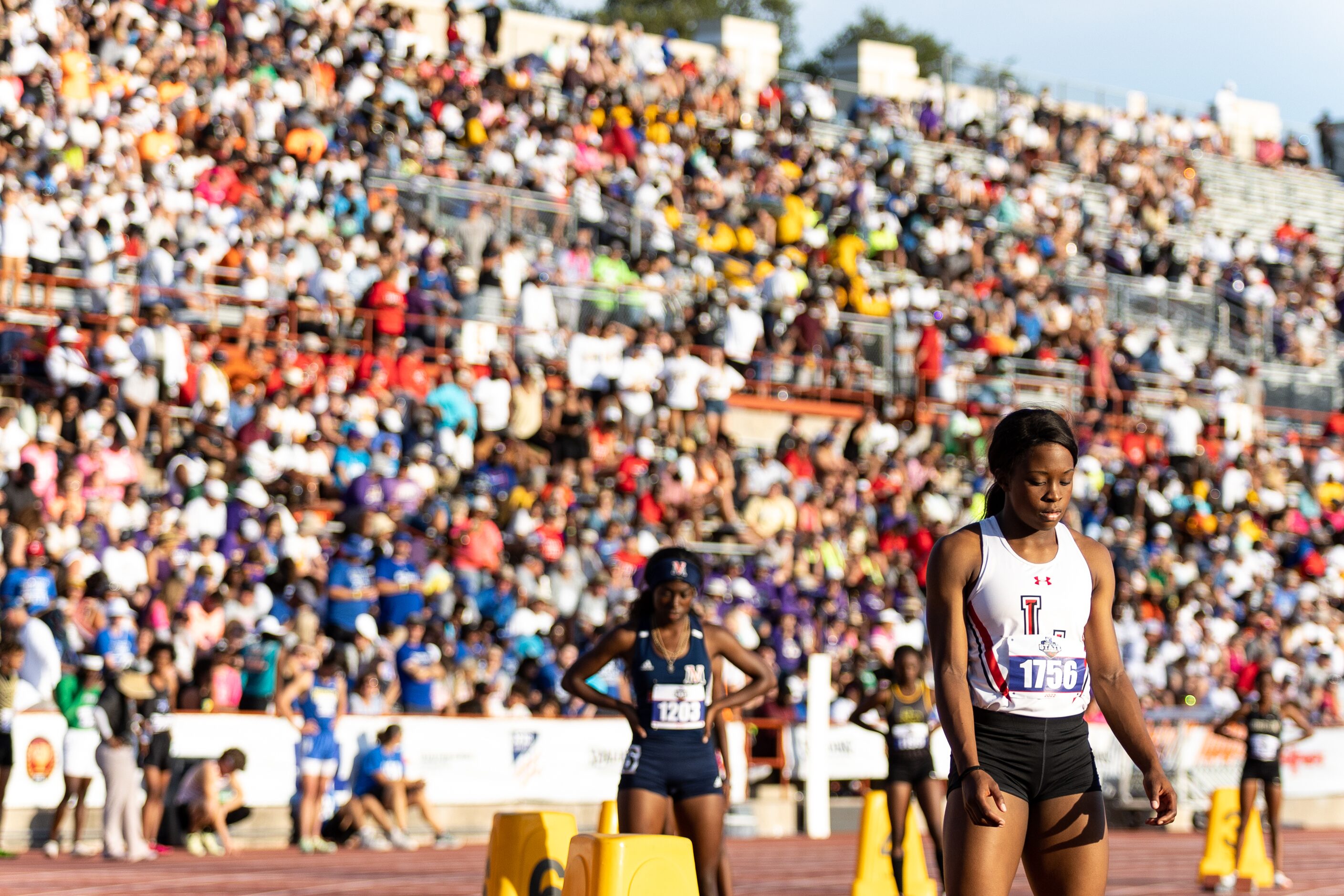 Christine Mallard of Mansfield Legacy prepares at the start for the girls’ 400m dash at the...