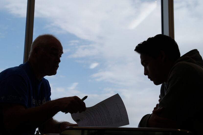 Lead counselor Al Marks, left, talks with Grand Prairie High School student William Jenkins,...