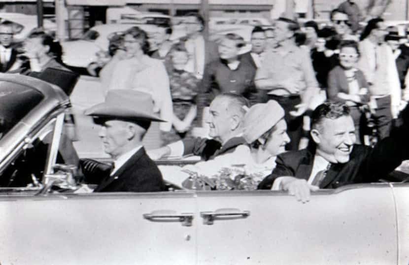 Vice President Lyndon Johnson, Lady Bird Johnson and Texas Sen. Ralph Yarborough ride...