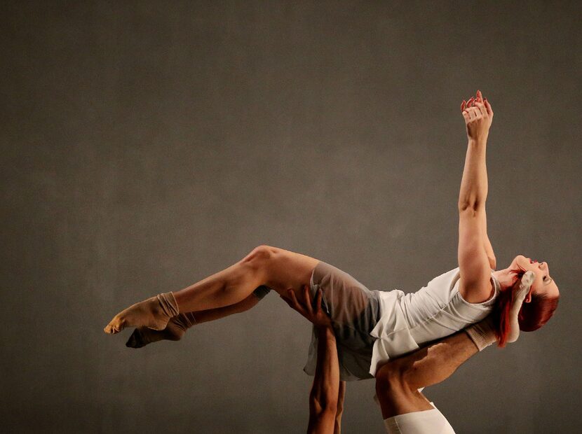 Emily Perry held aloft by another dancer in the Bruce Wood Dance Project's 'Bloom' at a...