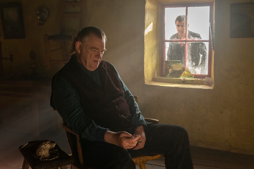 Brendan Gleeson (foreground) plays Colm, who sends Pádraic (Colin Farrell) into a spiral by...