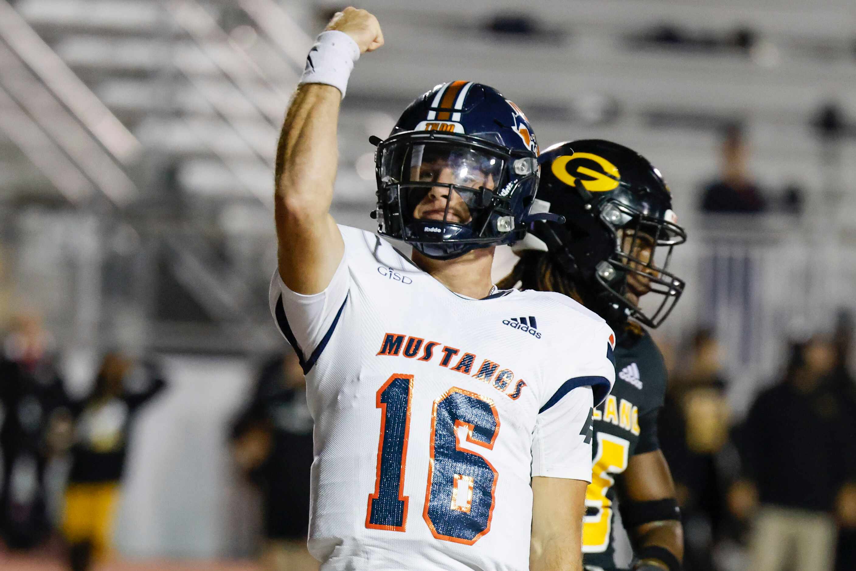 Sachse High School QB Brenden George celebrates after a touchdown during the first half of a...
