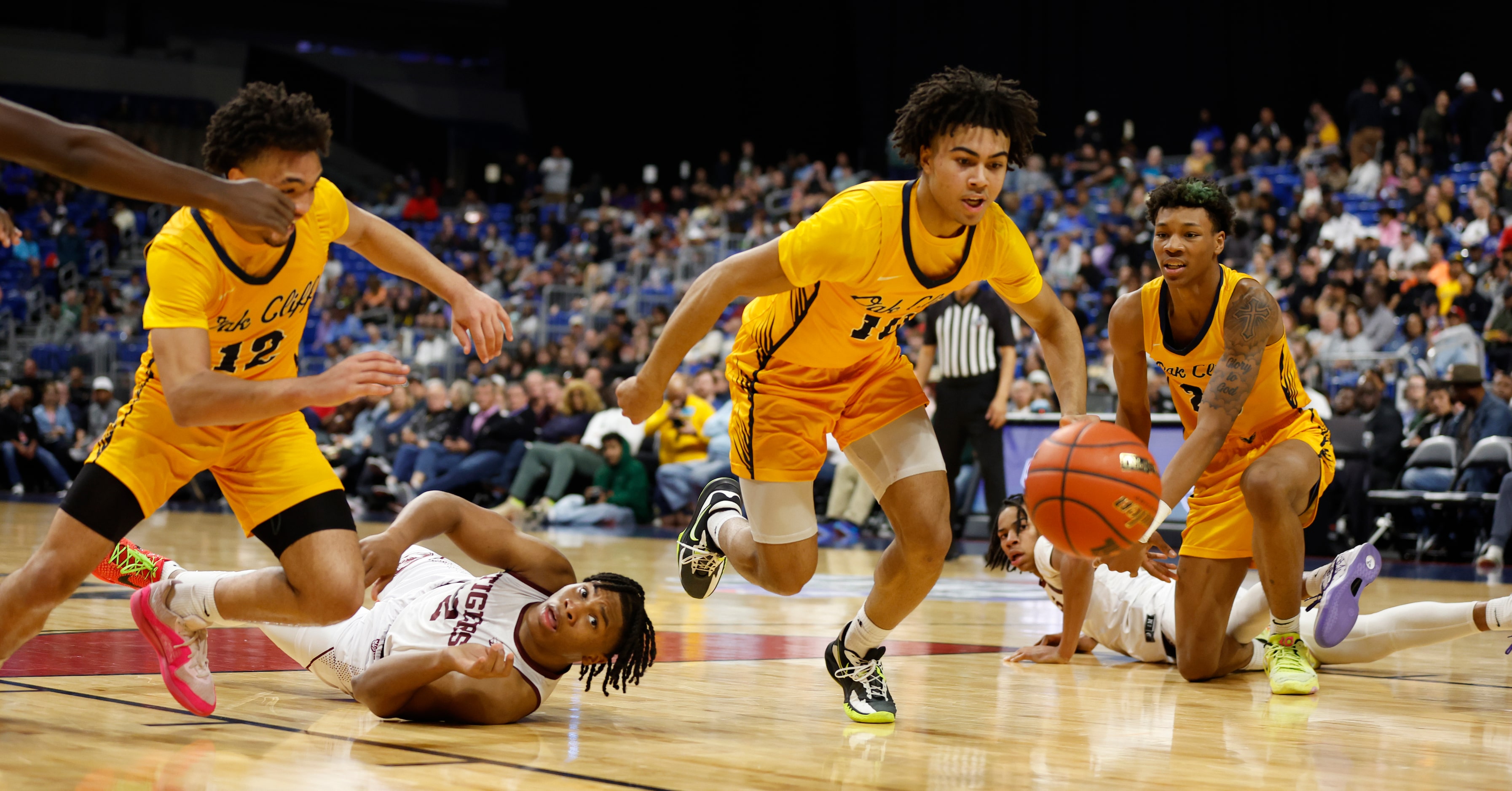 Oak Cliff Faith Family Academy Isaac Williams (10) steals the ball and goes for a lay-up....