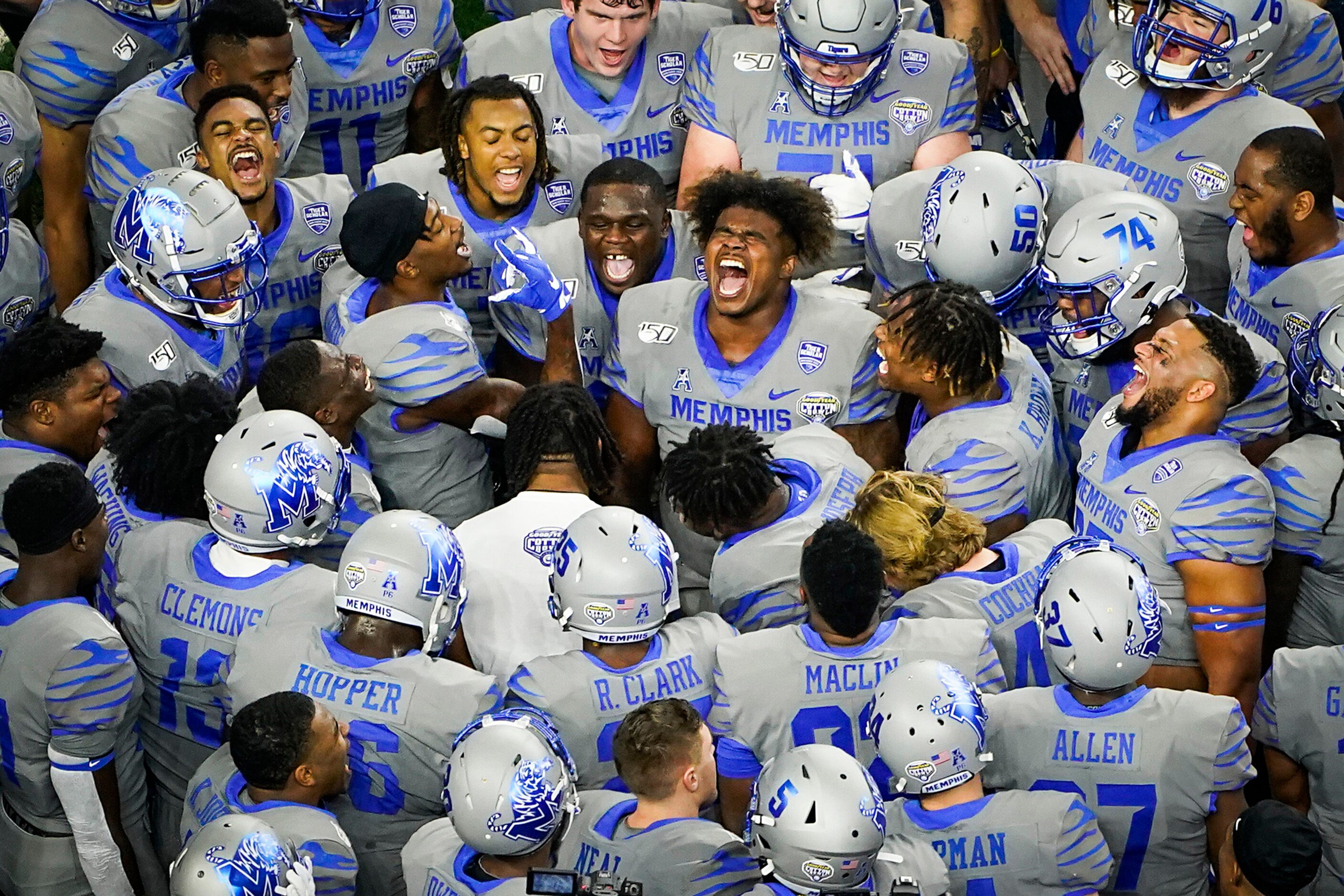 Memphis players huddle before the Goodyear Cotton Bowl Classic football game against Penn...