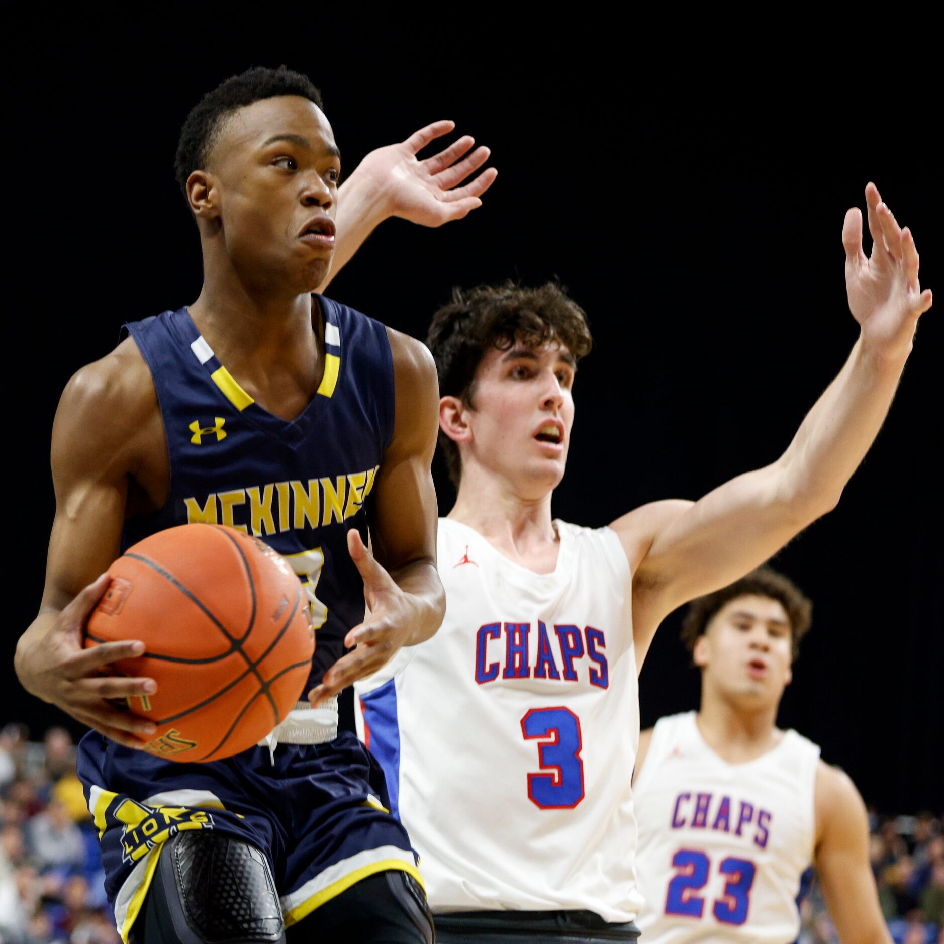 McKinney guard Jacovey Campbell (3) jumps as he looks to pass around Austin Westlake forward...