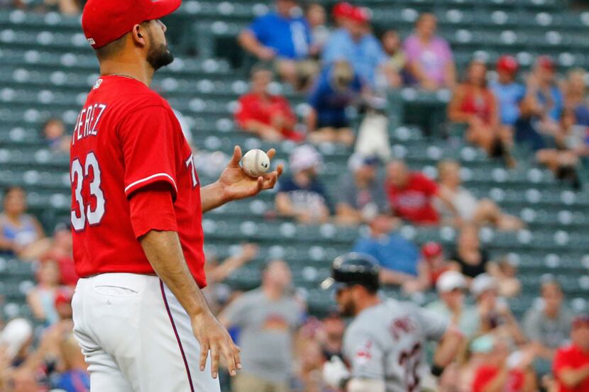 Texas Rangers starting pitcher Martin Perez (33) watches as Cleveland Indians second baseman...