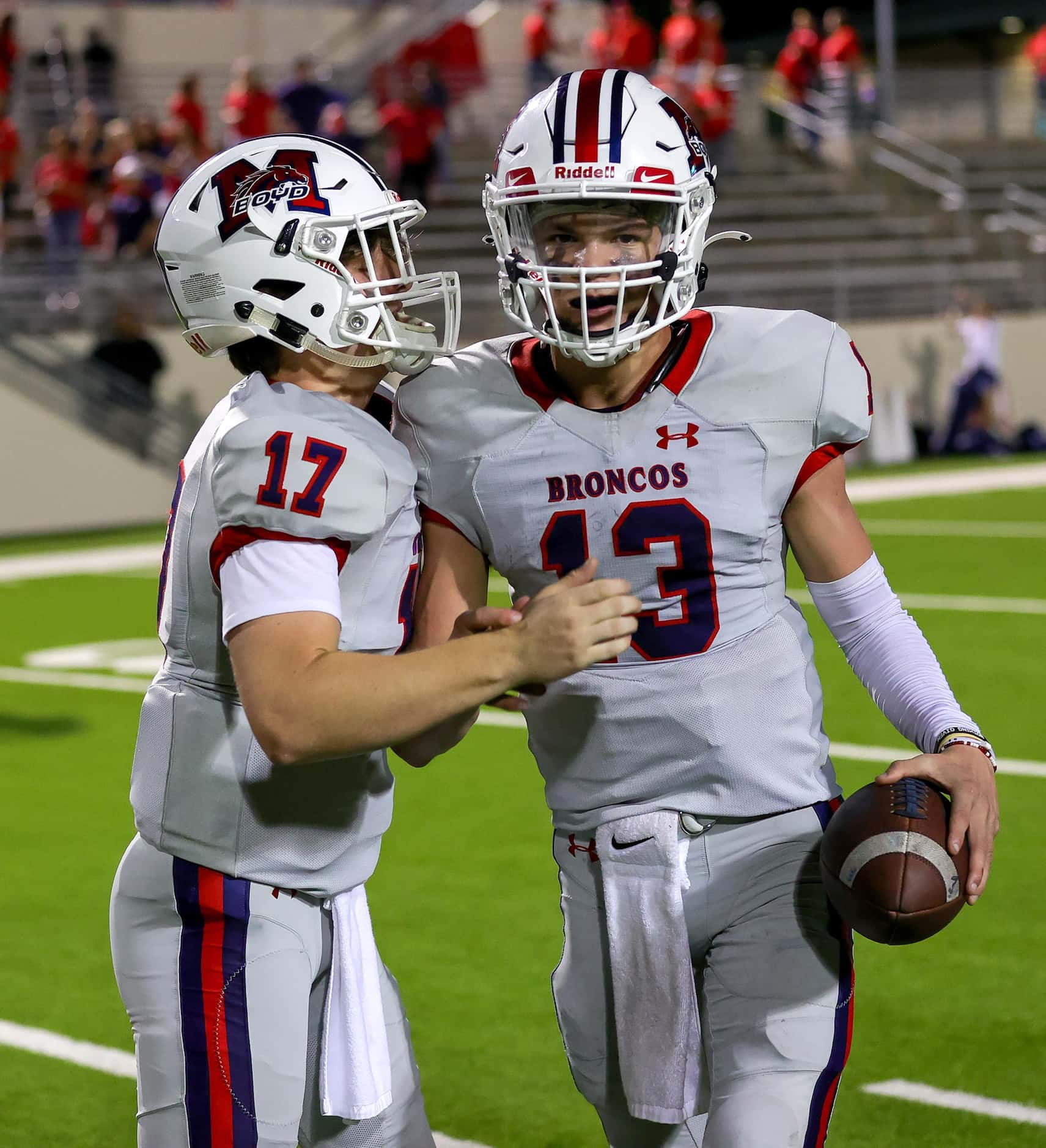 McKinney Boyd quarterback Ryan Shackleton (13) celebrates with Tyler Preator (17) after...