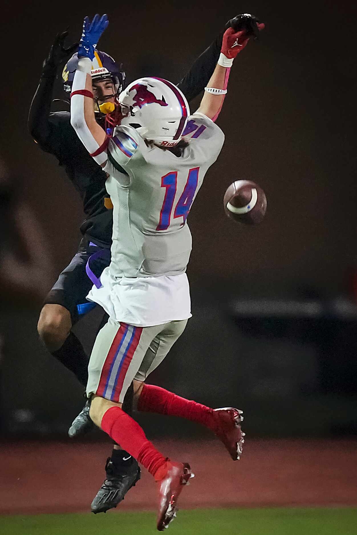 Richardson Pearce defensive back Tate Navin (14) breaks up a pass intended for Richardson’s...