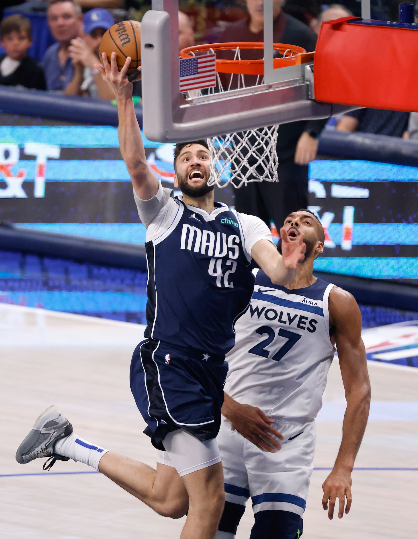 Dallas Mavericks forward Maxi Kleber (42) drives the lane past Minnesota Timberwolves center...