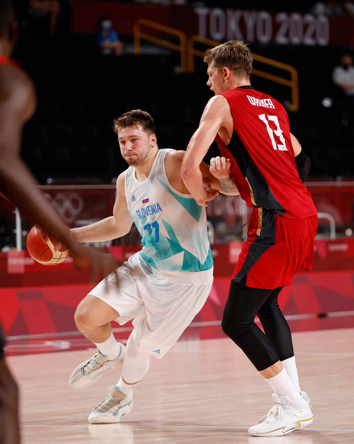 Slovenia’s Luka Doncic (77) drives on Germany’s Moritz Wagner (13) during the first half of...