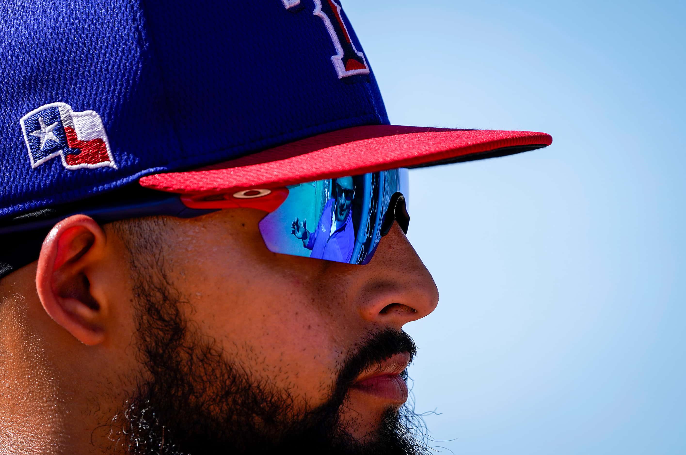 Texas Rangers second baseman Rougned Odor talks with special assistant/major league scout...