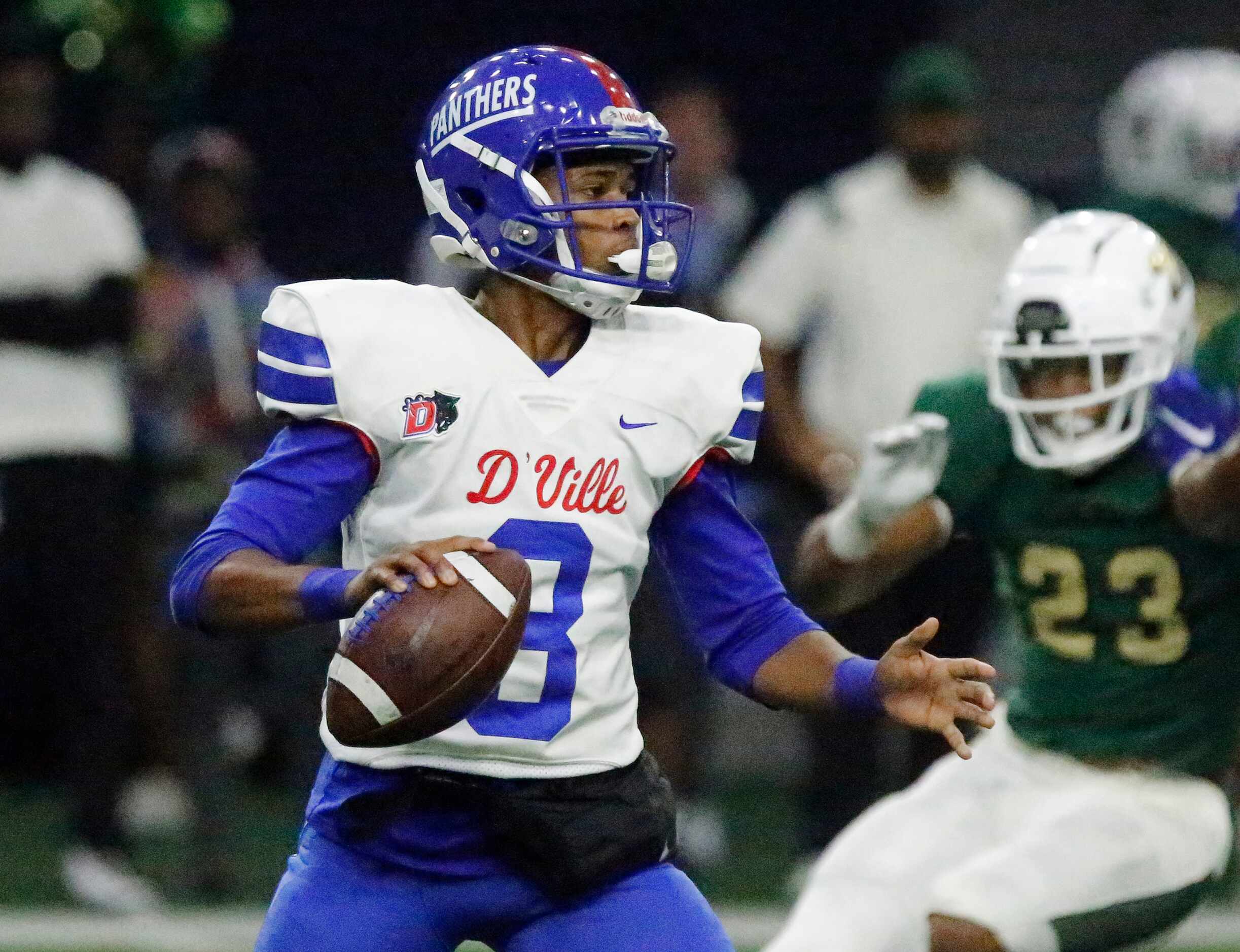 Duncanville High School quarterback Solomon James (3) makes his reads on a pass play during...