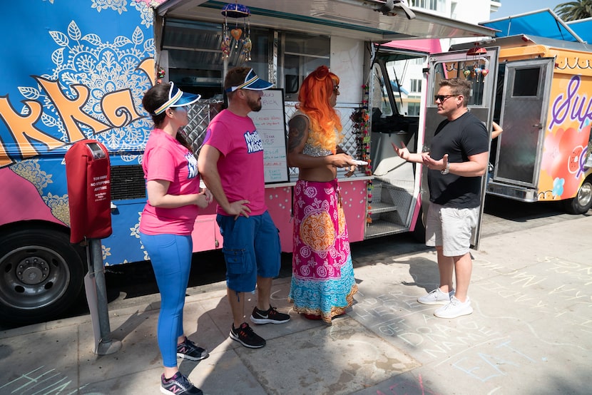 Team Mystikka Masala greets host Tyler Florence in Santa Monica, as seen on The Great Food...