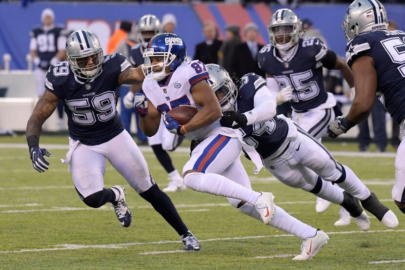 New York Giants wide receiver Sterling Shepard (87) is pursued by Dallas Cowboys linebackers...