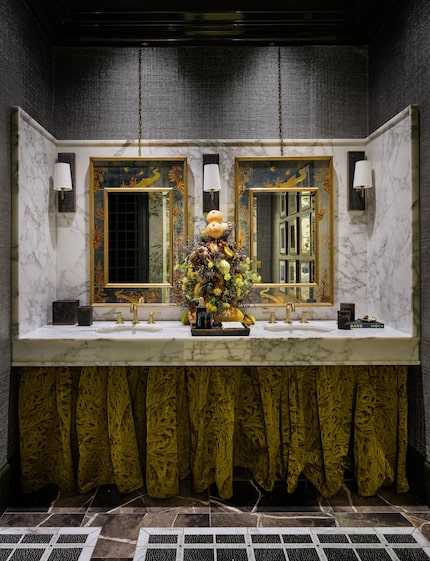 Suiting inspired Ink + Oro's design of the men's bathroom, which bears a mosaic tile...