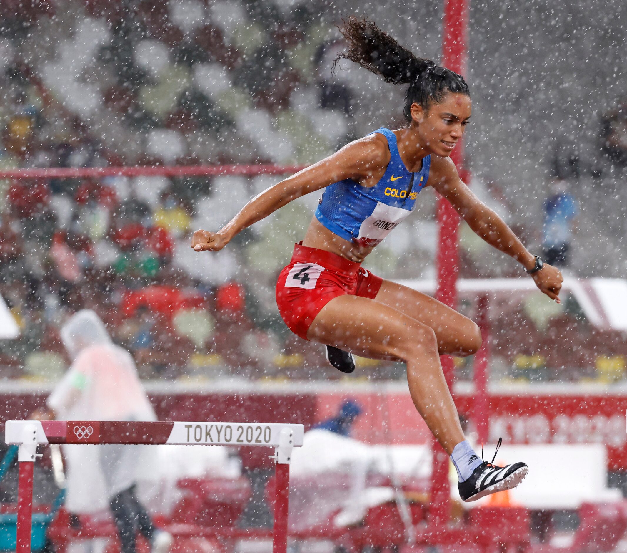 Columbia’s Melissa Gonzalez competes in the women’s 400 meter hurdles semifinal during the...