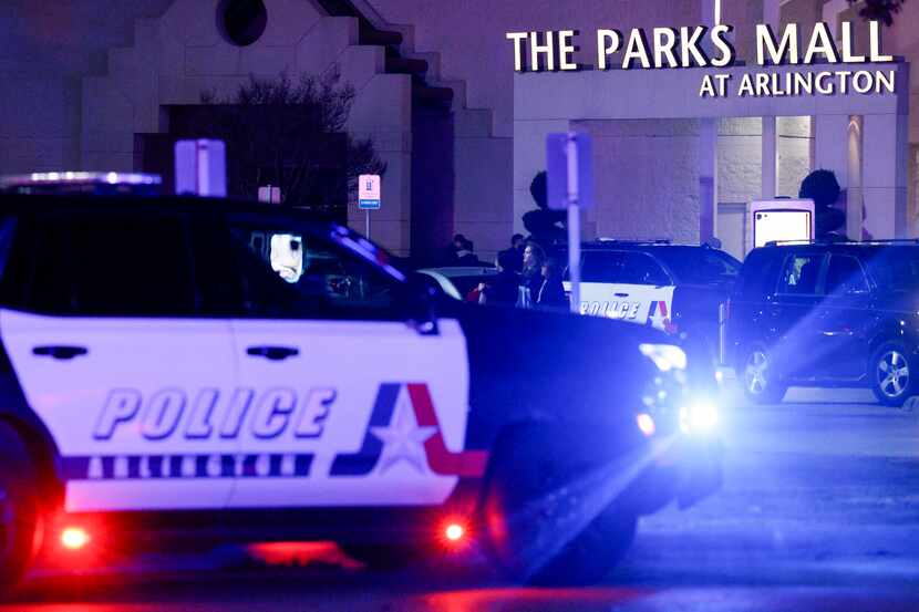 Arlington police work the scene after two people were wounded in a shooting at The Parks...