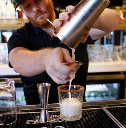 Lead bartender Adrian Cleek prepares the Snowbird at Snowbird, a coming-soon cocktail bar in...