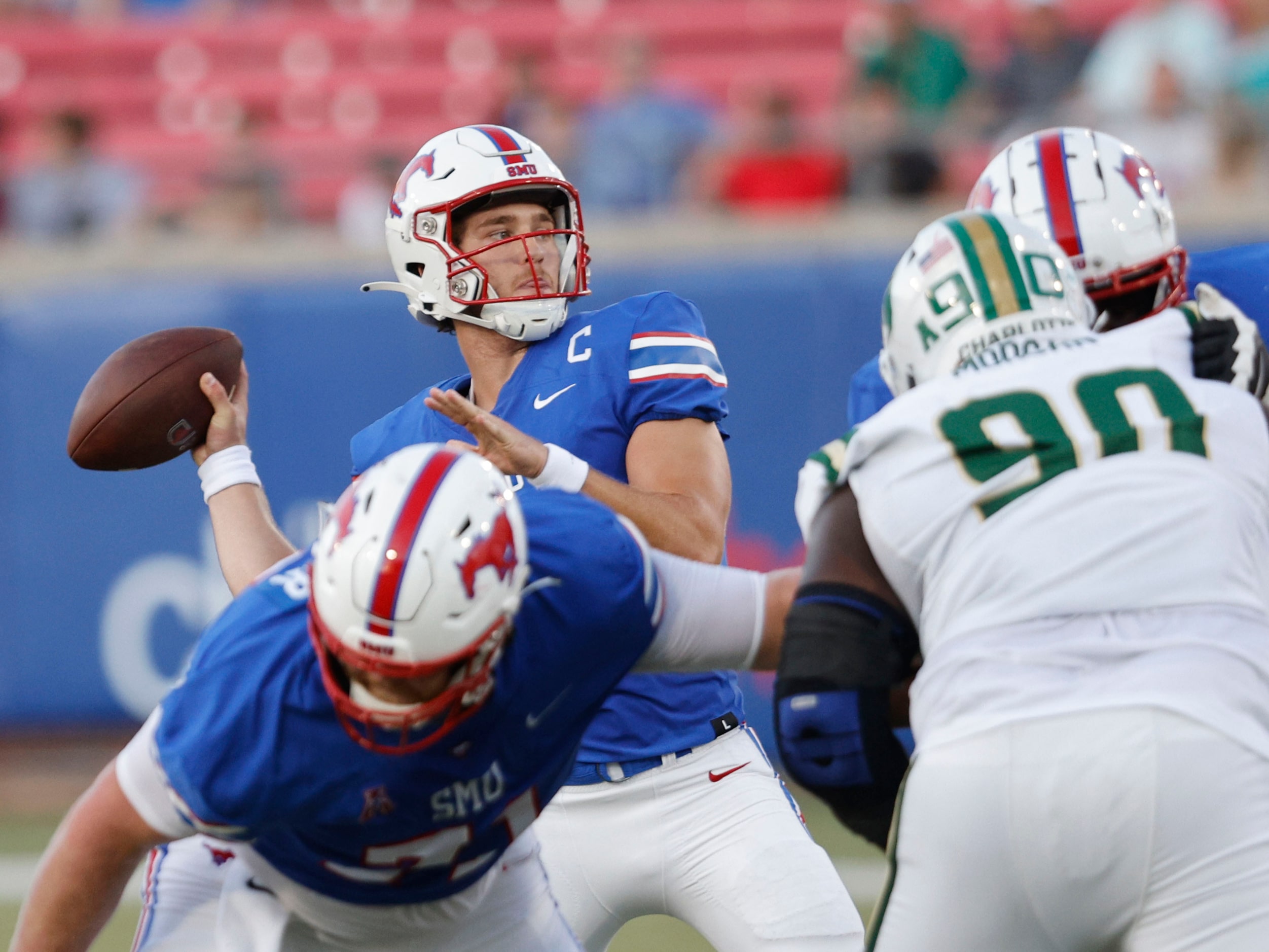 SMU quarterback Preston Stone (2) passes under pressure from Charlotte 49ers defensive...