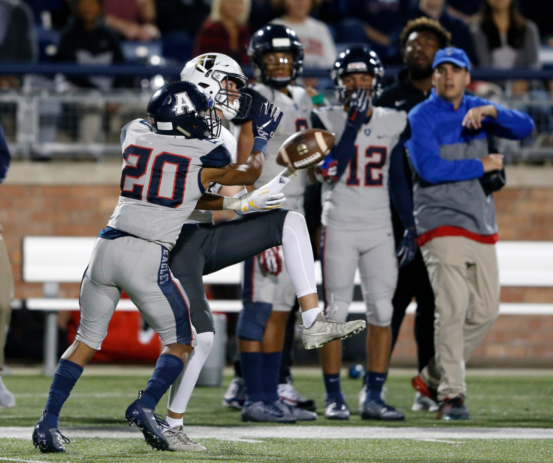 Jesuit's Christian Allocco (1) makes a catch in front of Allen's Matthew Tousant (20) during...