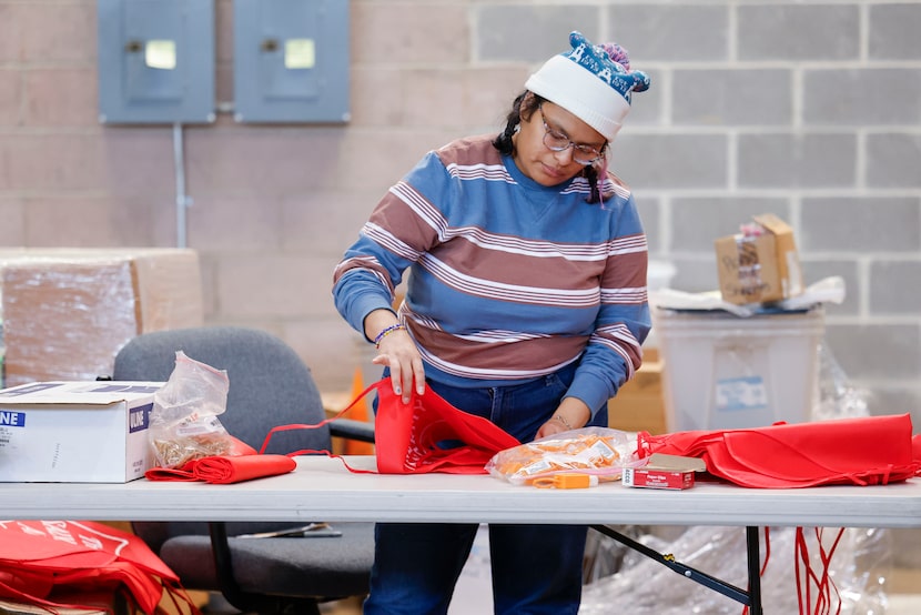 Mia Martinez works inside the The Salvation Army of North Texas warehouse, on Friday, Nov....