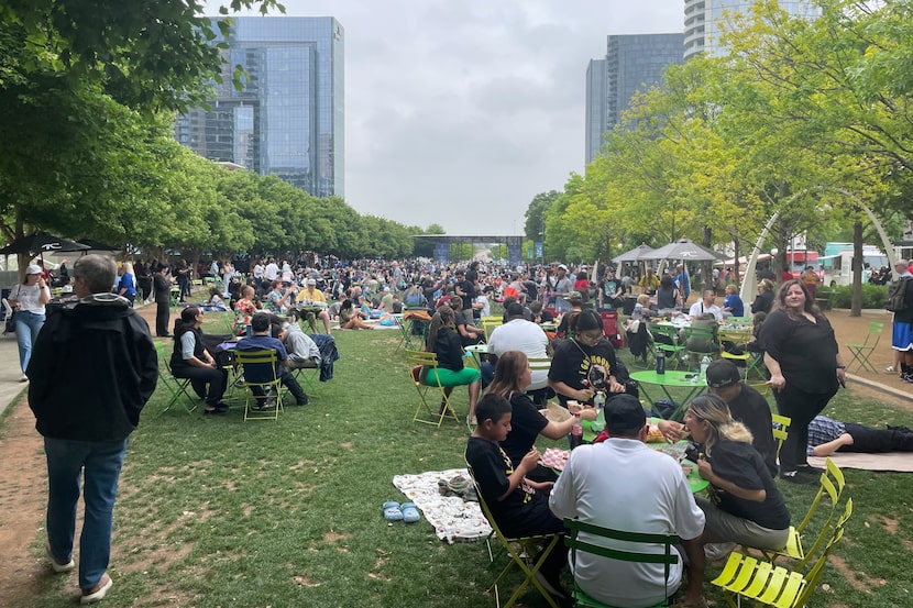 Eclipse watchers fill Klyde Warren Park on Monday, April 8, 2024, in Dallas. 
