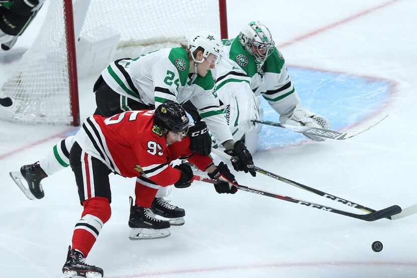 Chicago Blackhawks right wing Dylan Sikura (95) and Dallas Stars left wing Roope Hintz (24)...