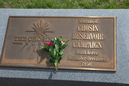 Hannah Kim placed these flowers at a small memorial that honors Korean War veterans at...