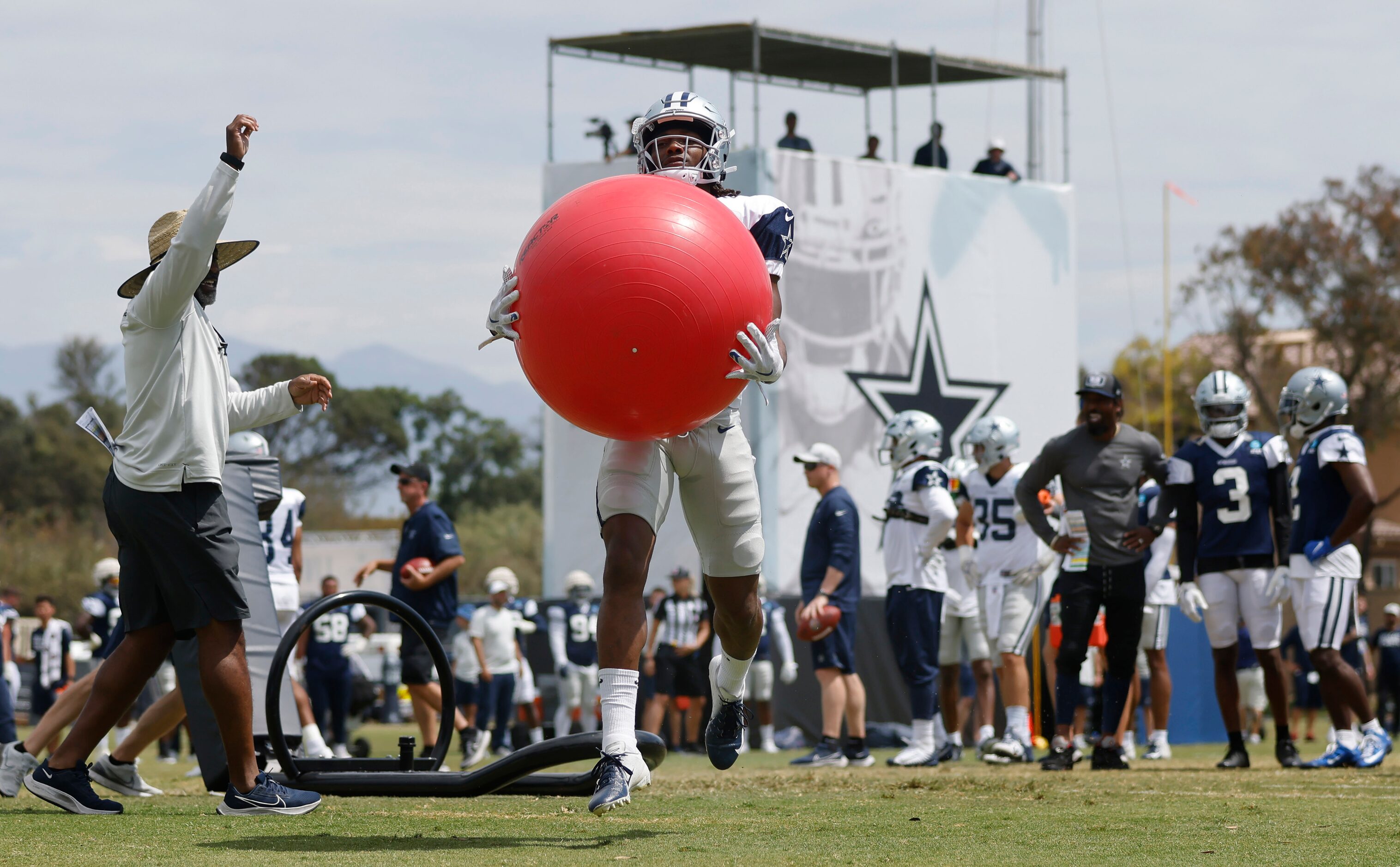 Dallas Cowboys wide receiver Brandon Smith (80) catches a red exercise ball after pushing...