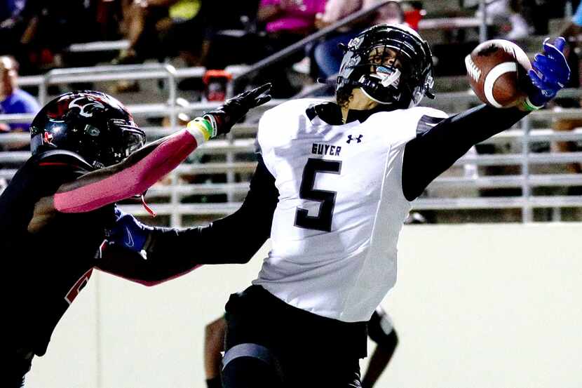 Denton Guyer wide receiver Jace Wilson (5) tries to come up with a one handed reception...