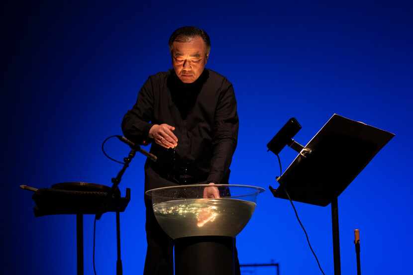 Violinist Cho-Liang Lin rustles water during a Chamber Music International performance of...